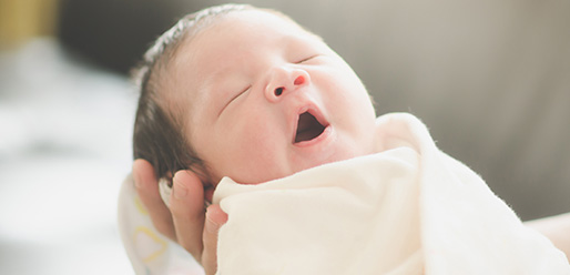 New born baby yawning